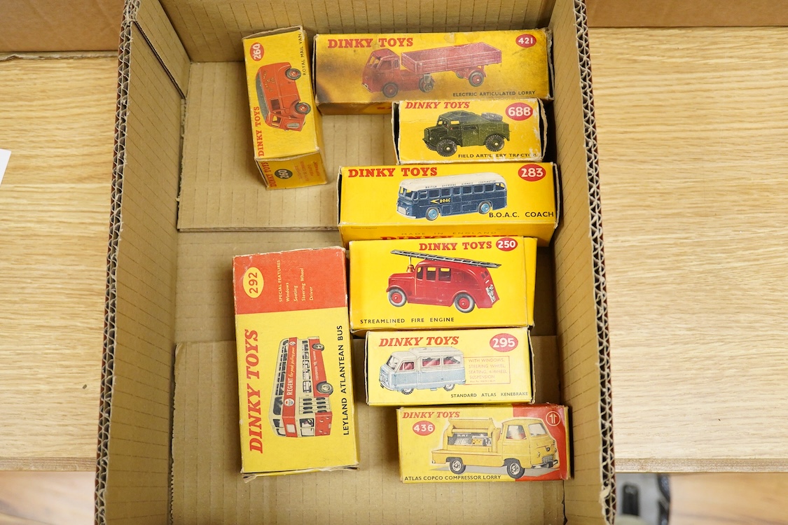 Eight boxed Dinky Toys; Royal Mail van (260), Leyland Atlantean bus (292), Atlas Copco Compressor Lorry (436), Standard Atlas Kenebrake (295), BOAC coach (283), Streamlined Fire Engine (250), Field Artillery Tractor (688